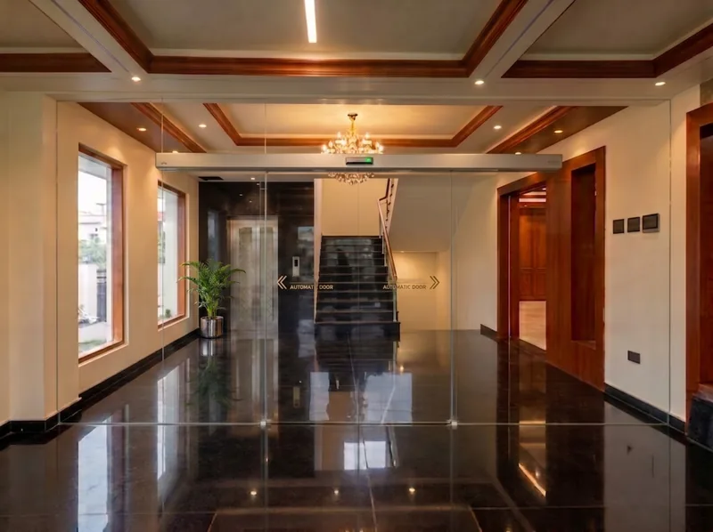 Entrance lobby of SLNT Mahal marriage hall, Madurai, with polished granite floor and chandelier